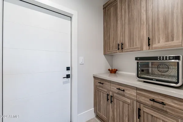 a kitchen with a cabinets and a stove top oven