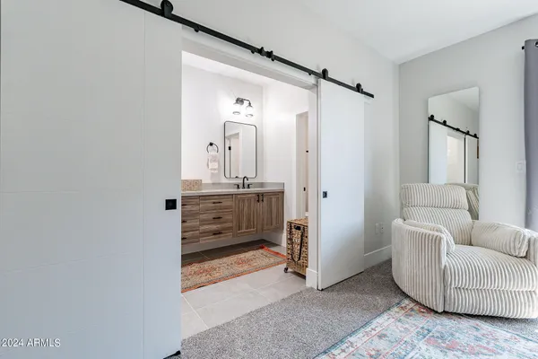a view of a livingroom with furniture and windows