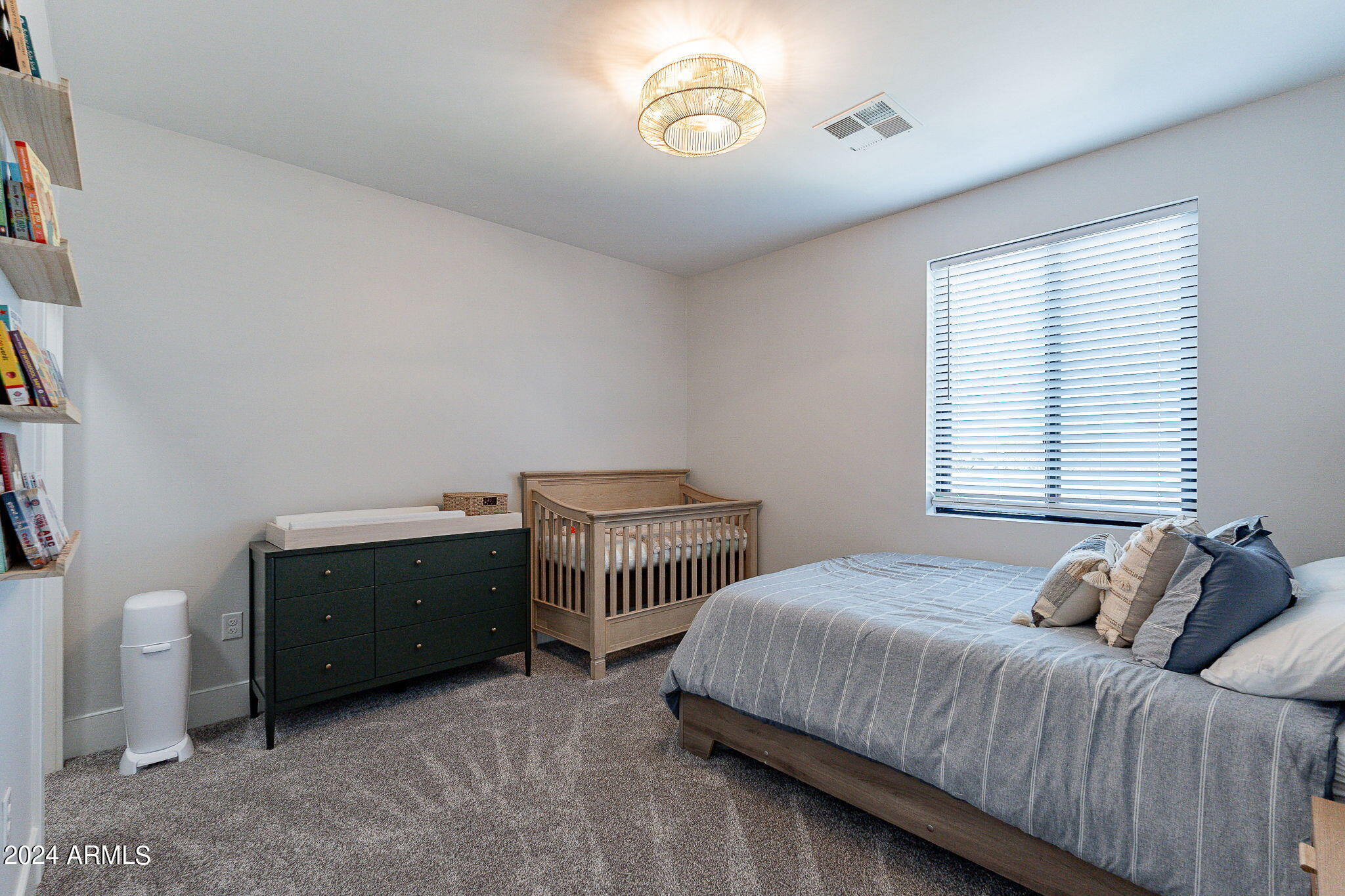 142 East Hearne Way Gilbert, AZ 85234 - Photo 22 of 44 a bedroom with a bed and a window