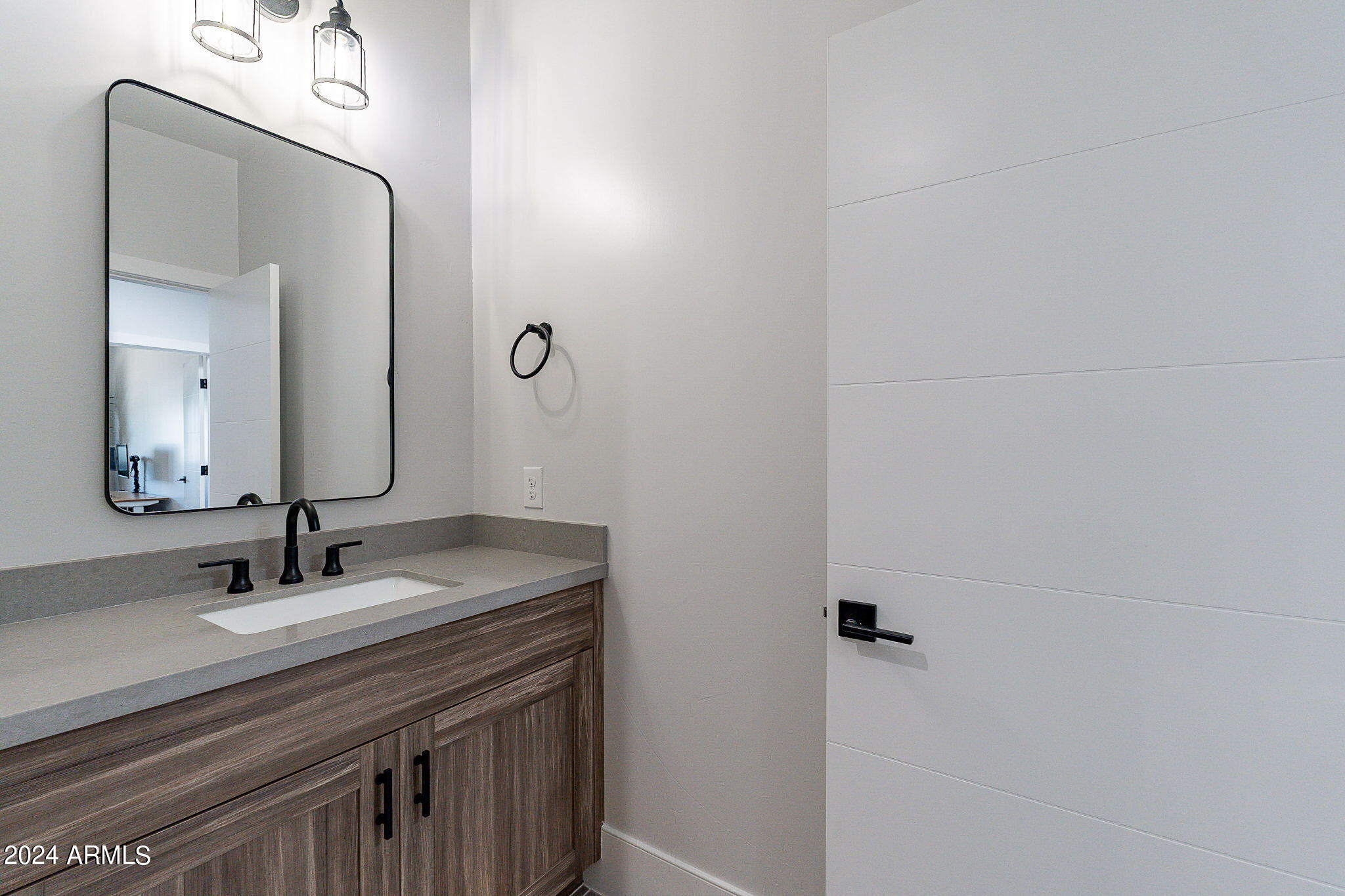 142 East Hearne Way Gilbert, AZ 85234 - Photo 23 of 44 a bathroom with a sink and a mirror