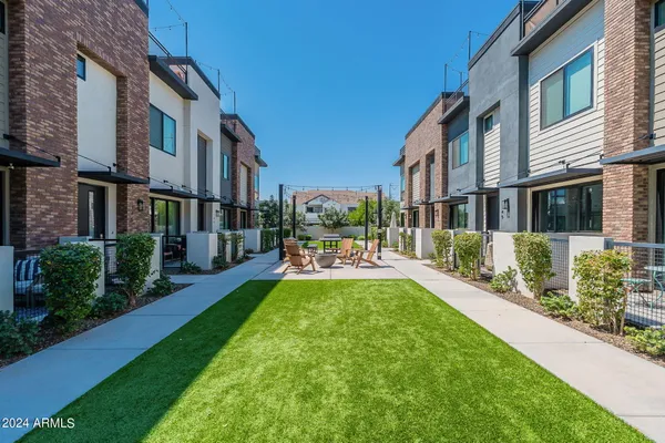 a view of a building with a yard