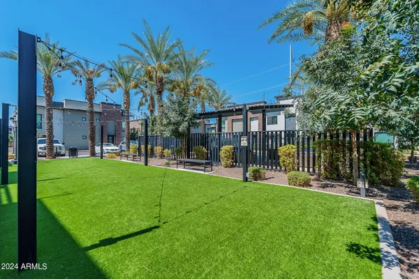 a view of a house with a yard and a patio