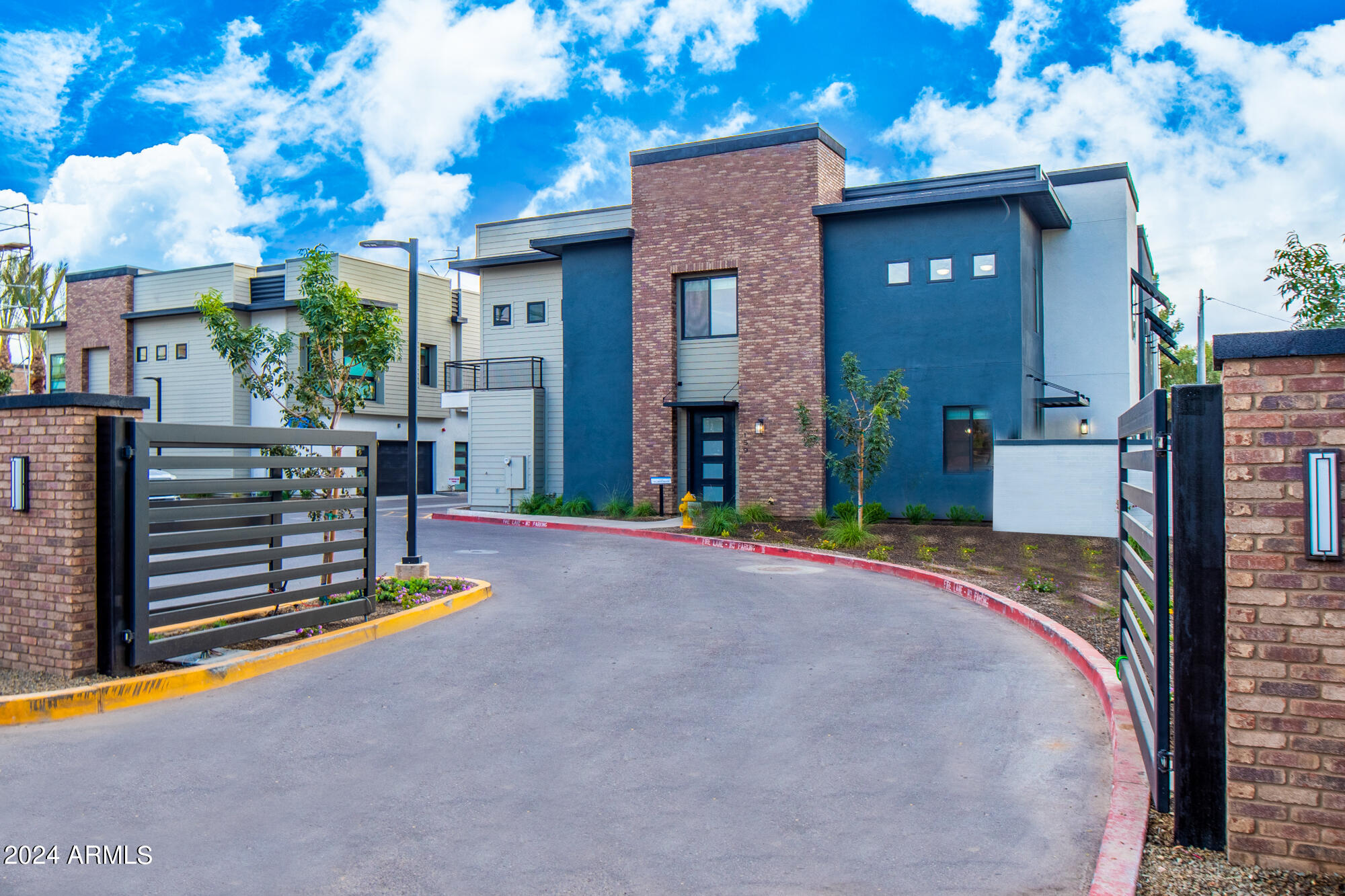 142 East Hearne Way Gilbert, AZ 85234 - Photo 35 of 44 a view of a house with backyard and a garage