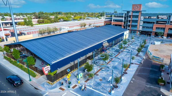 a view of a balcony with chairs and wooden floor