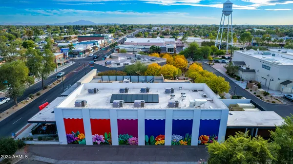 a view of swimming pool with outdoor seating and city view