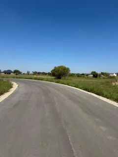 a view of a street with a ocean view