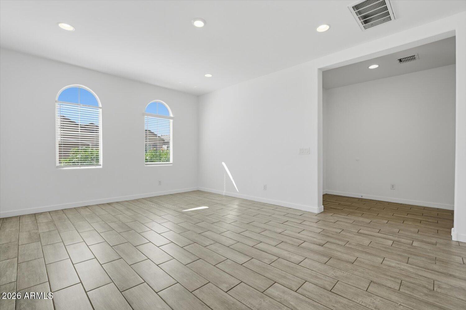 2542 West Pecan Road Phoenix, AZ 85041 - Photo 10 of 30 an empty room with windows
