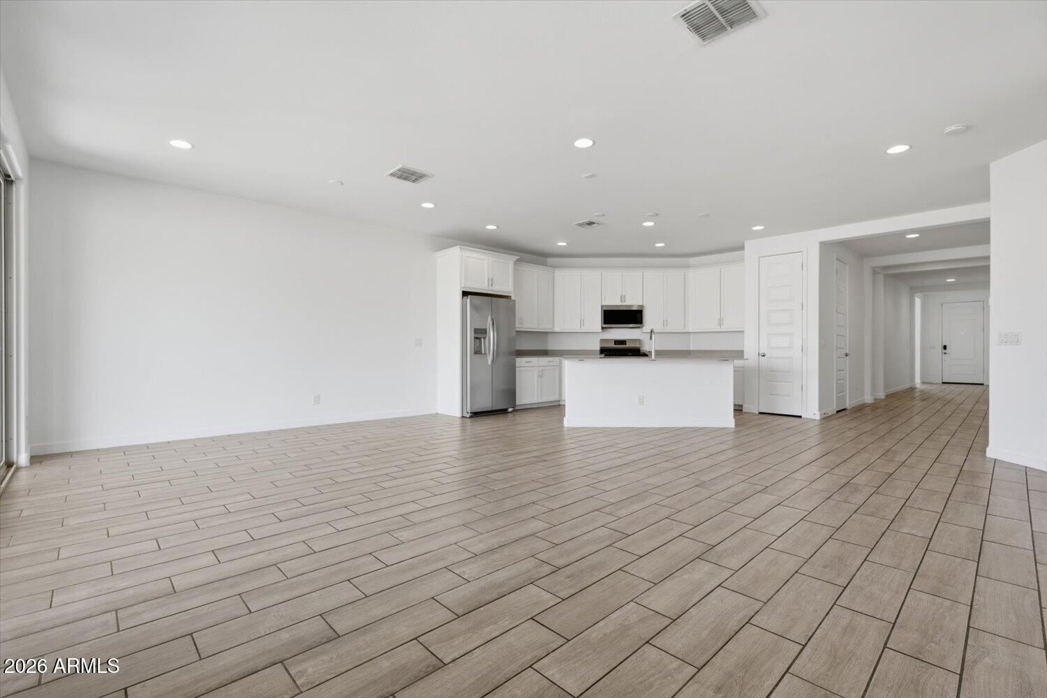 2542 West Pecan Road Phoenix, AZ 85041 - Photo 11 of 30 a view of kitchen with kitchen island microwave and refrigerator