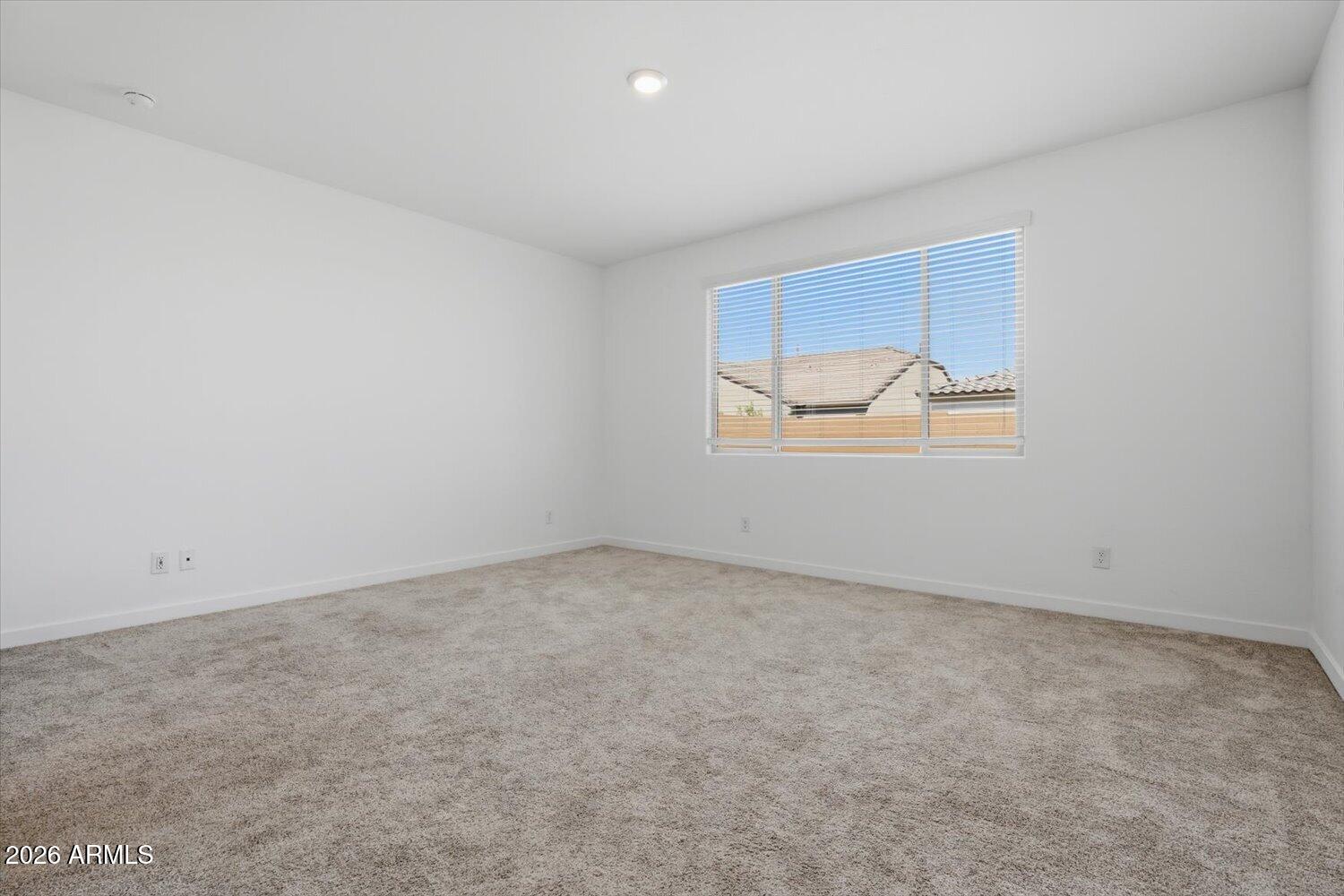 2542 West Pecan Road Phoenix, AZ 85041 - Photo 13 of 30 an empty room with a window