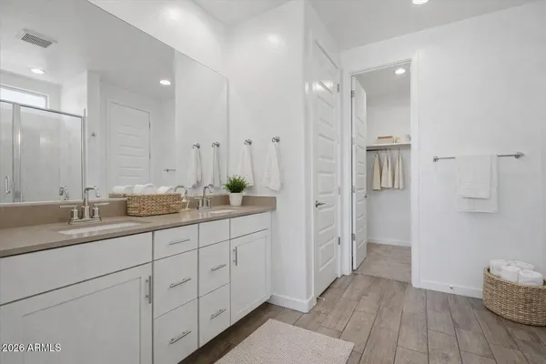 a bathroom with a granite countertop sink a toilet and bathtub