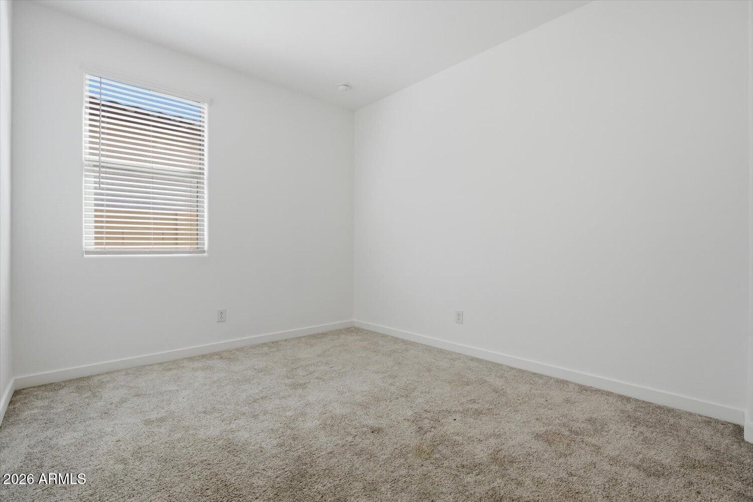 2542 West Pecan Road Phoenix, AZ 85041 - Photo 19 of 30 an empty room with a window