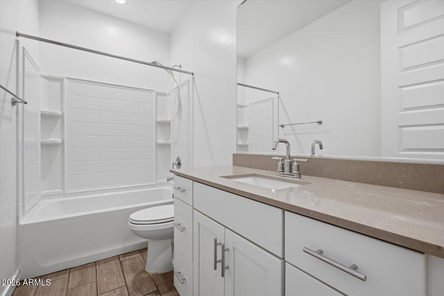 2542 West Pecan Road Phoenix, AZ 85041 - Photo 23 of 30 a bathroom with a sink a toilet and shower