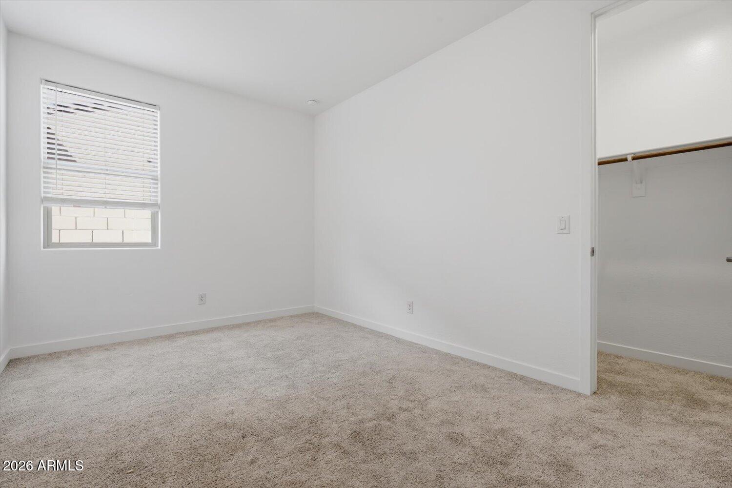 2542 West Pecan Road Phoenix, AZ 85041 - Photo 24 of 30 an empty room with a window