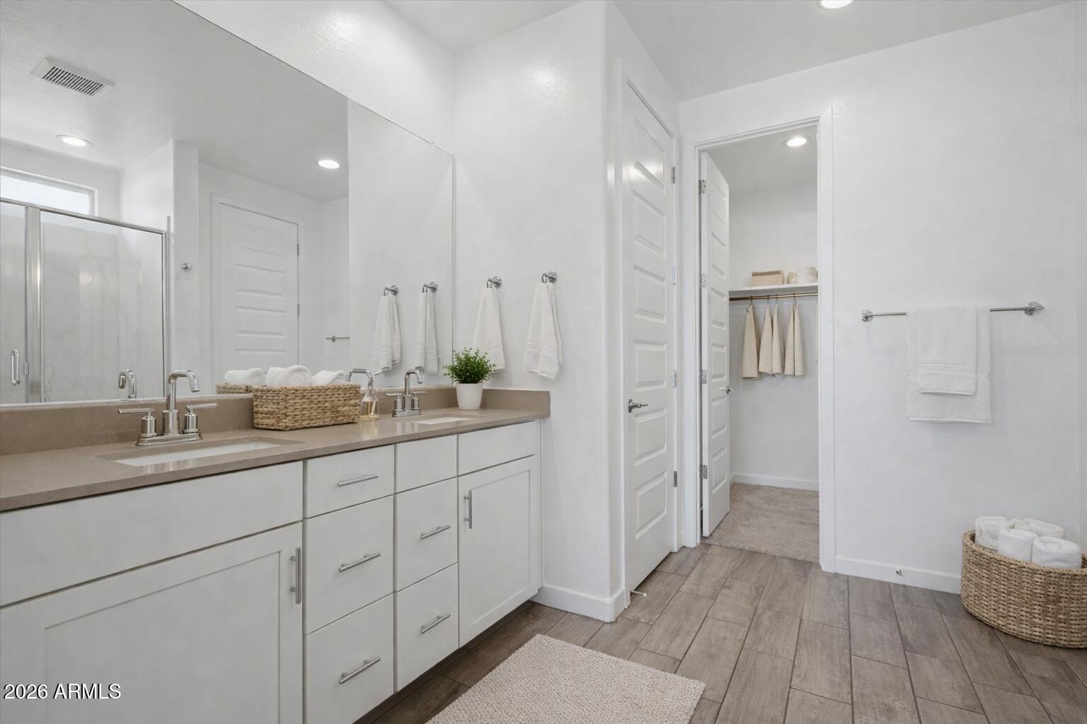 2542 West Pecan Road Phoenix, AZ 85041 - Photo 5 of 30 a bathroom with double vanity and a mirror