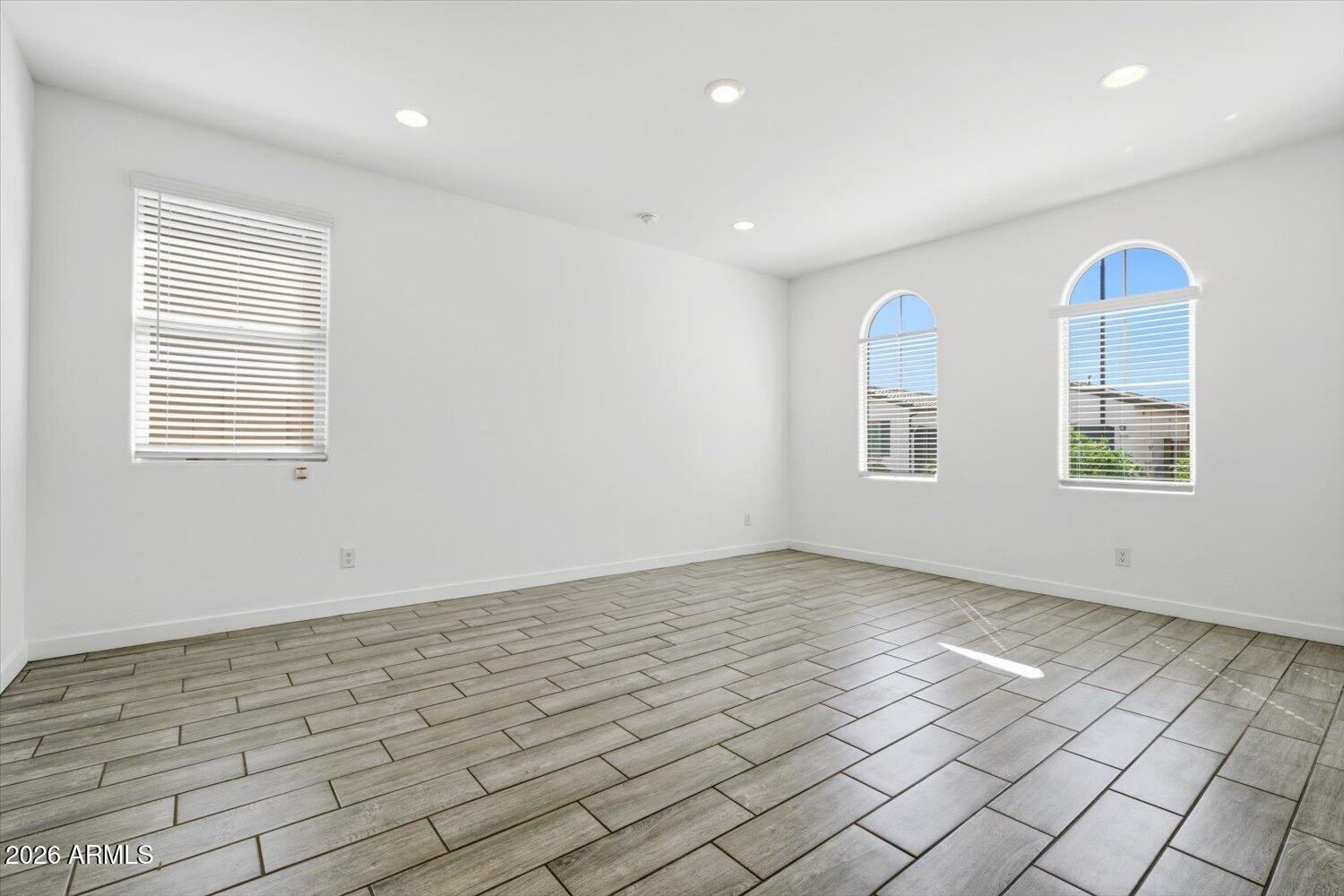 2542 West Pecan Road Phoenix, AZ 85041 - Photo 7 of 30 an empty room with windows