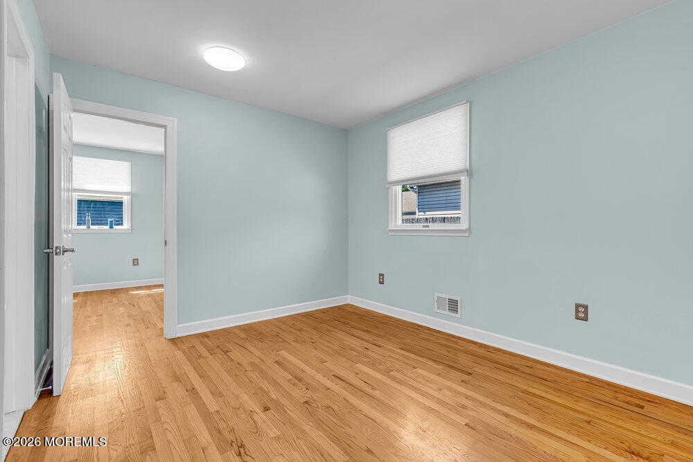 1407 Edgemere Road Wall, NJ 07719 - Photo 8 of 16 a view of empty room with wooden floor