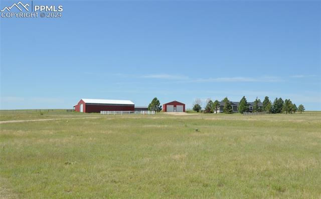 34115 Big Springs Road Yoder, CO 80864 - Photo 35 of 35 View of yard with a rural view and an outdoor structure