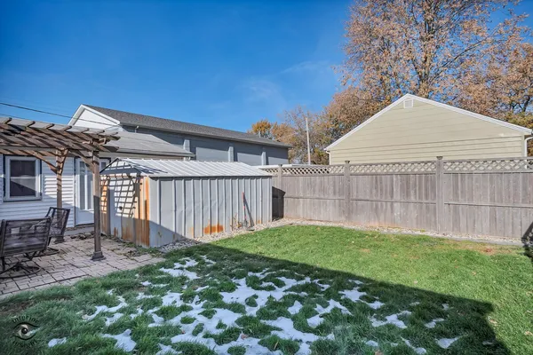 a view of a backyard with a small cabin