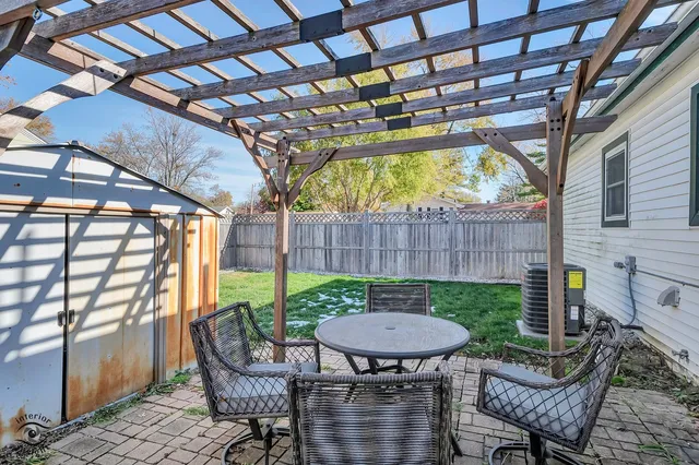a view of a table and chairs in the patio