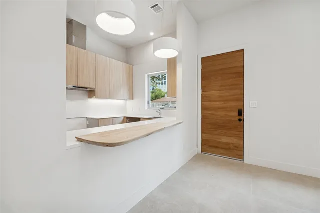 a bathroom with a sink a mirror and a shower