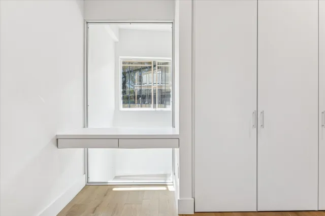 a bathroom with a sink a shower and a mirror