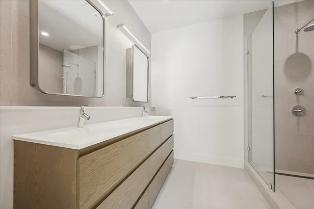 a bathroom with a shower and sink