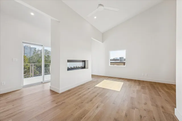 a view of hallway with wooden floor
