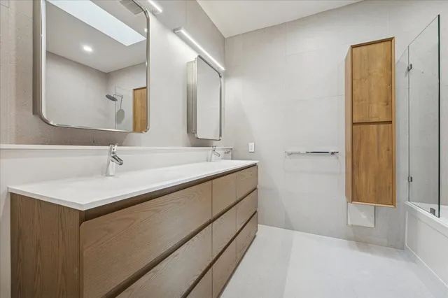 a bathroom with a bathtub and a shower