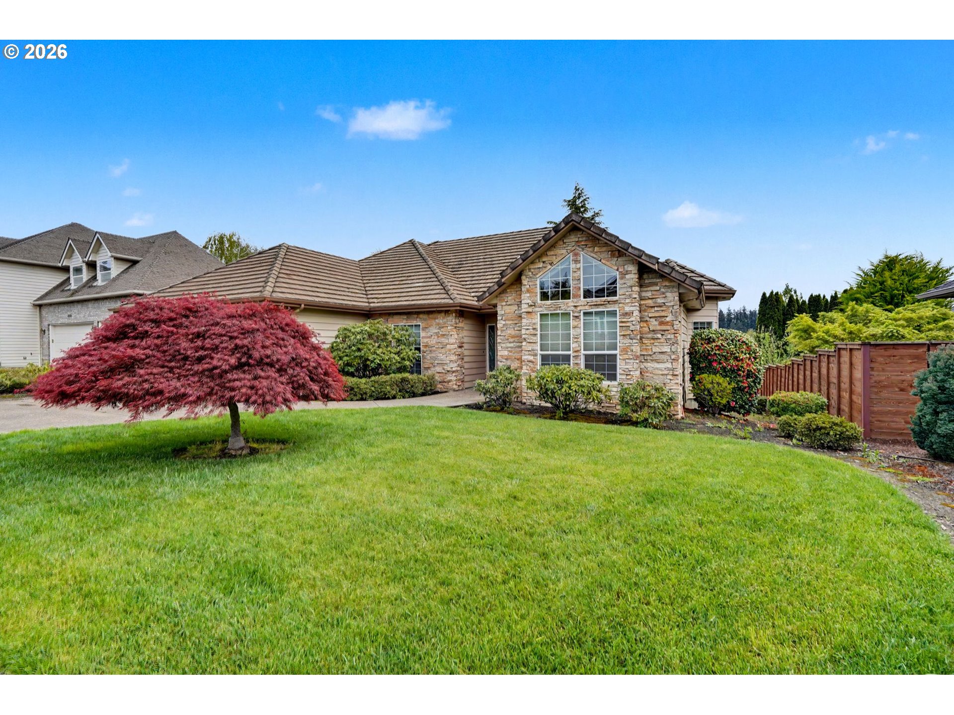 1470 Ranier Loop Northwest Salem, OR 97304 - Photo 2 of 48 a front view of a house with a yard