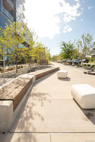 a view of swimming pool with outdoor seating and plants