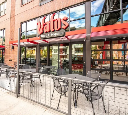 a view of a cafe with a table and chairs
