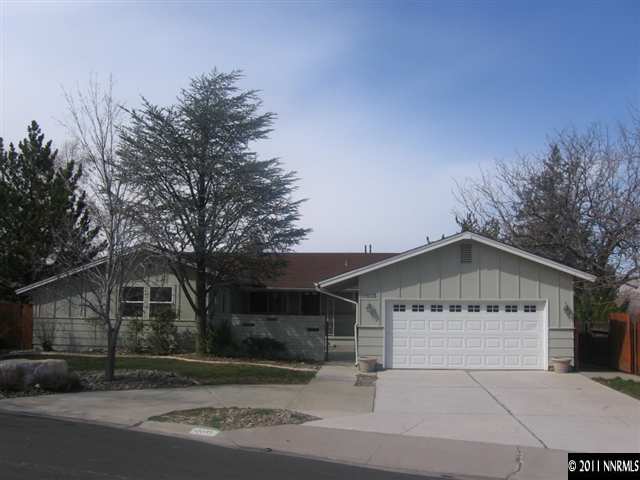 2035 Regent Street Reno, NV 89509 - Photo 1 of 13 a front view of a house with a yard and garage