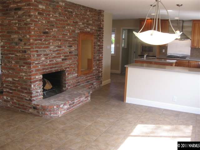 2035 Regent Street Reno, NV 89509 - Photo 4 of 13 a room with a fireplace a sink and a mirror