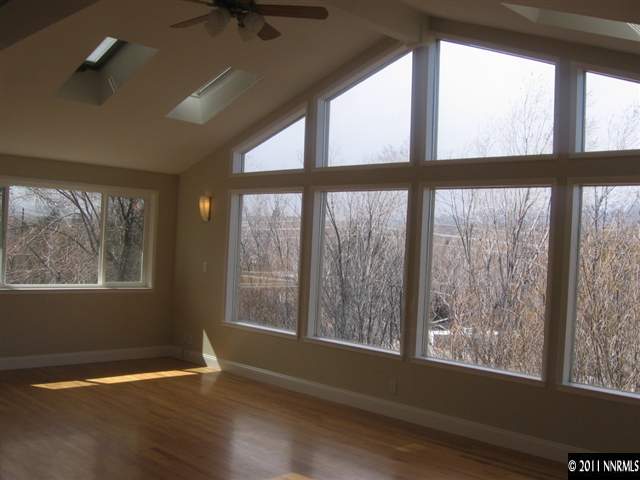 2035 Regent Street Reno, NV 89509 - Photo 5 of 13 a view of an empty room with wooden floor and a window