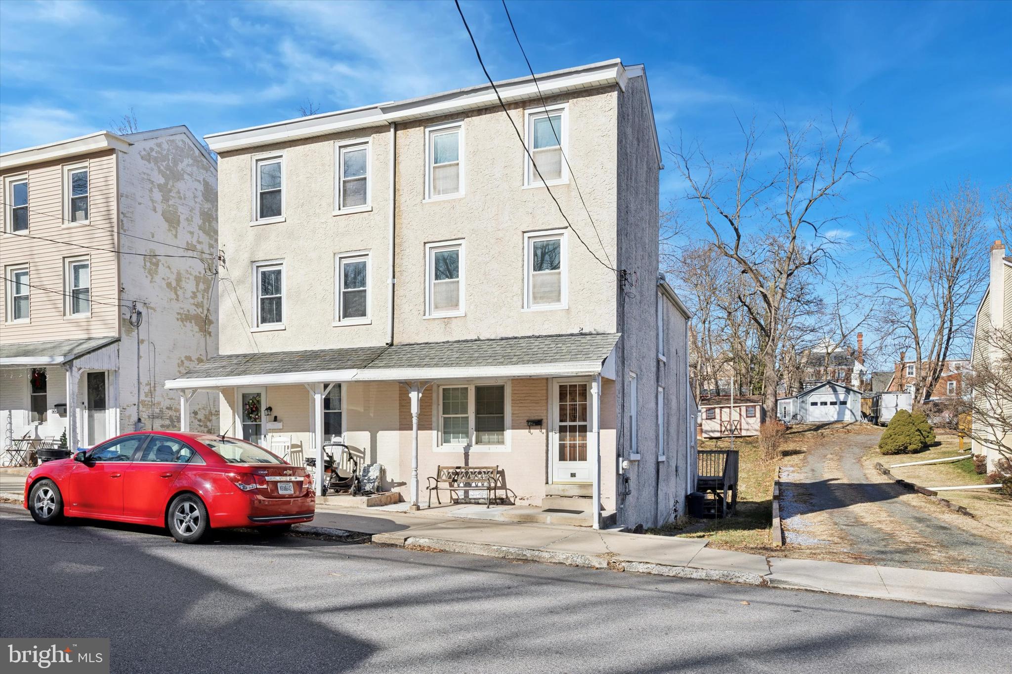 a front view of a building with parking space