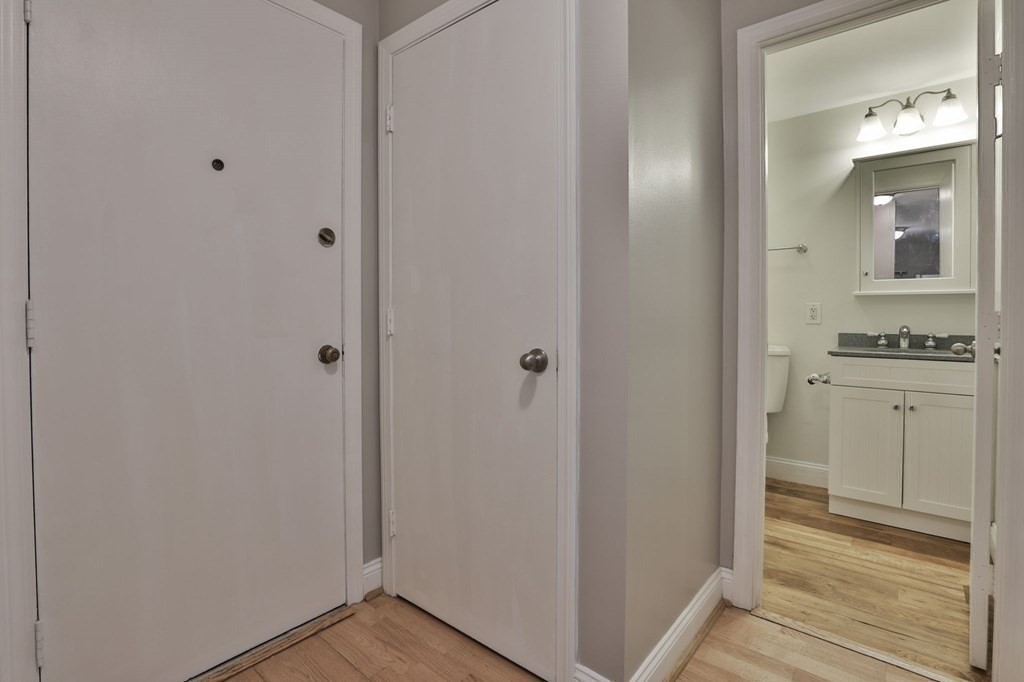 56 Leonard Road, Unit 56 Boxborough, MA 01719 - Photo 13 of 26 a view of bathroom with a sink mirror and window