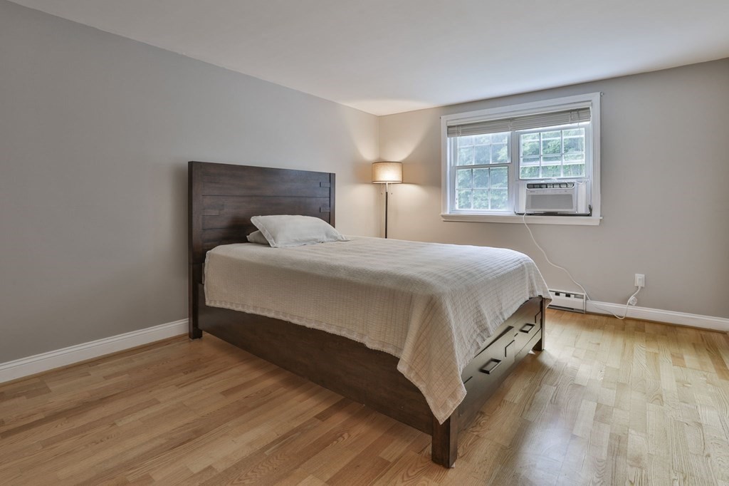 56 Leonard Road, Unit 56 Boxborough, MA 01719 - Photo 16 of 26 a bedroom with a bed and window