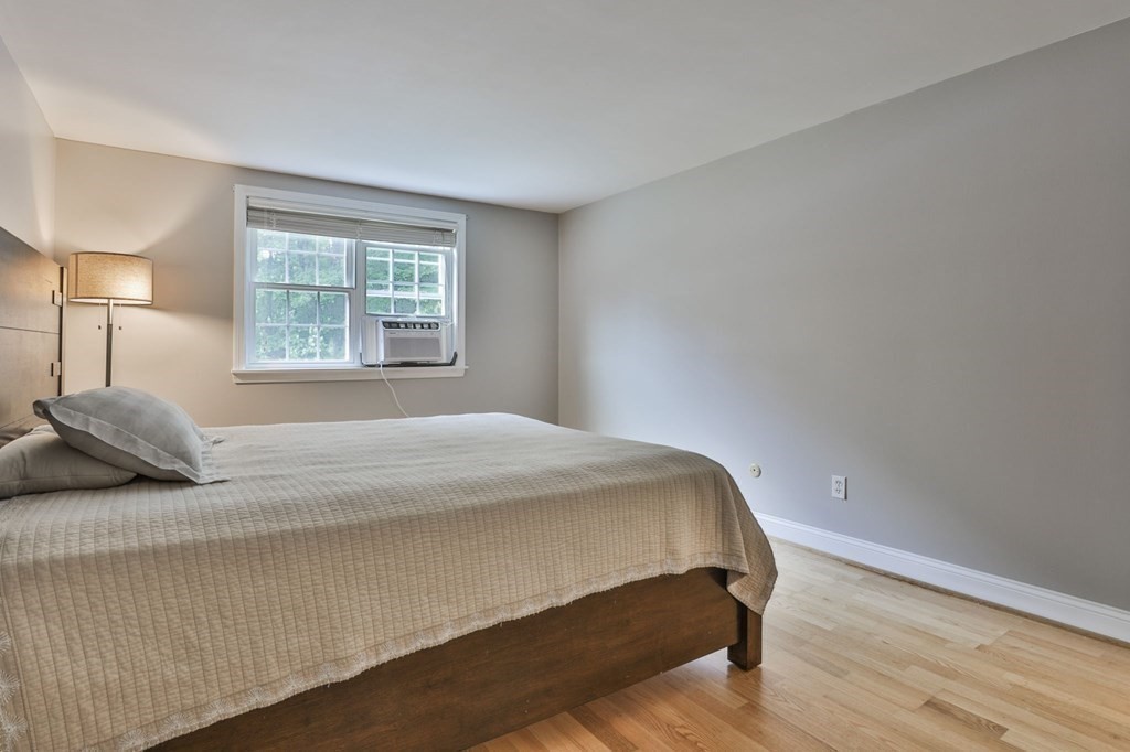 56 Leonard Road, Unit 56 Boxborough, MA 01719 - Photo 17 of 26 a bedroom with a bed and a window