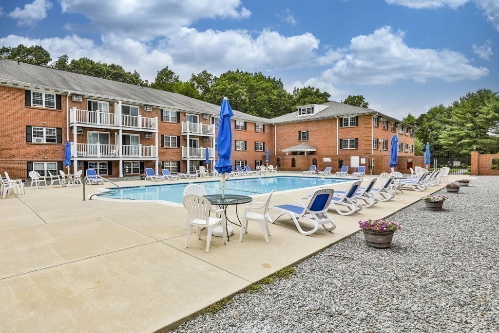 56 Leonard Road, Unit 56 Boxborough, MA 01719 - Photo 20 of 26 a swimming pool with outdoor seating and yard