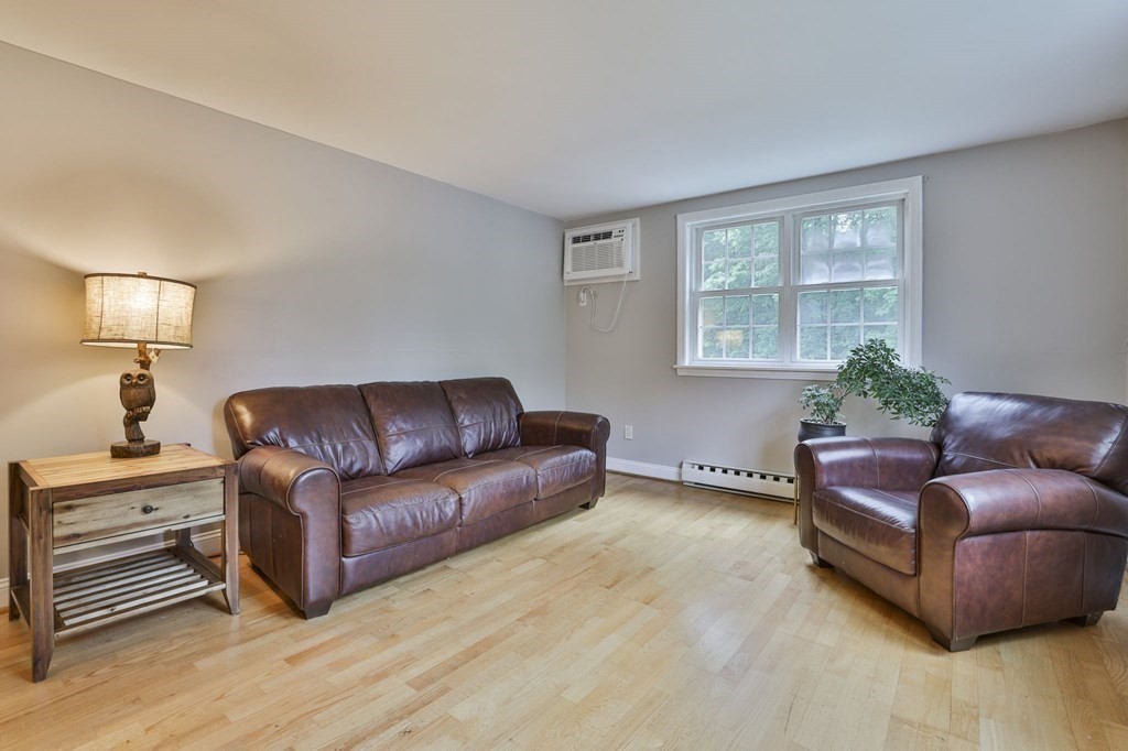 56 Leonard Road, Unit 56 Boxborough, MA 01719 - Photo 3 of 26 a living room with furniture and a window