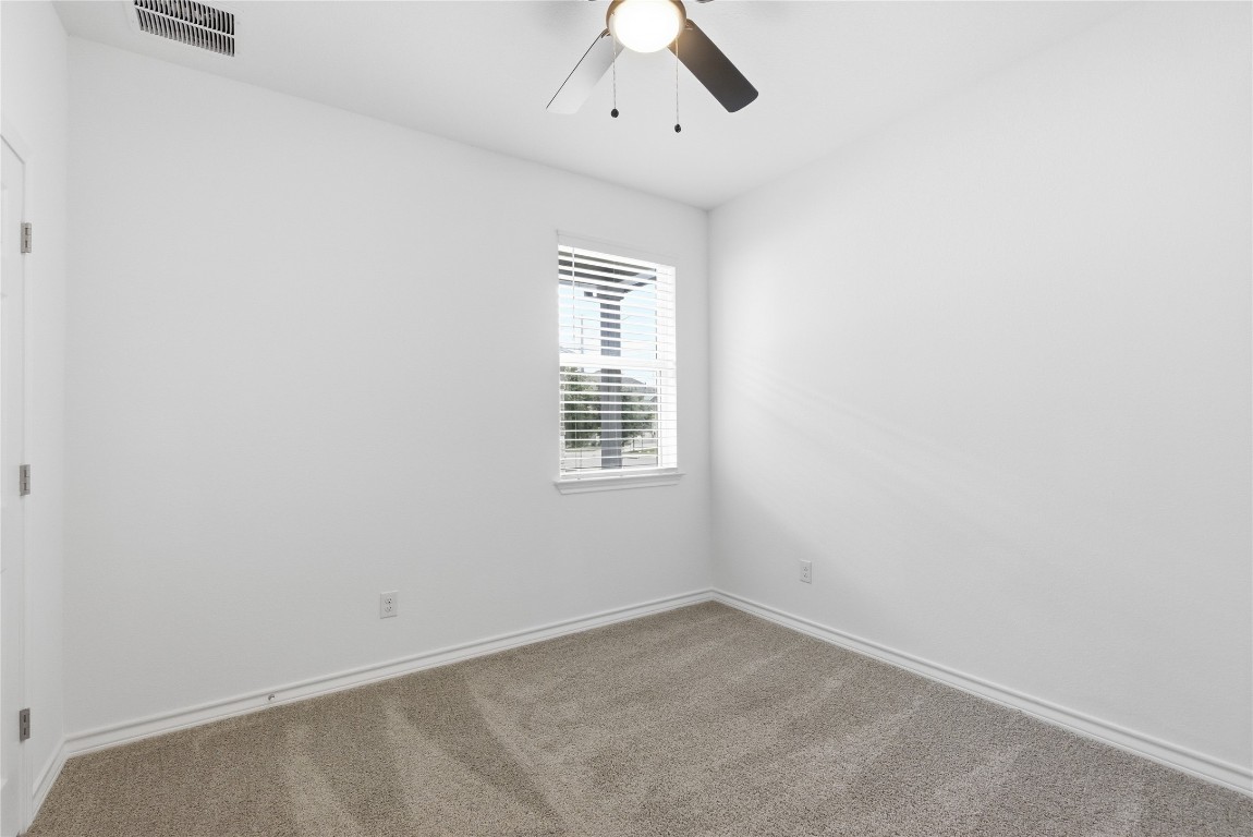209 Thurman Holt Road Hutto, TX 78634 - Photo 11 of 32 an empty room with a window