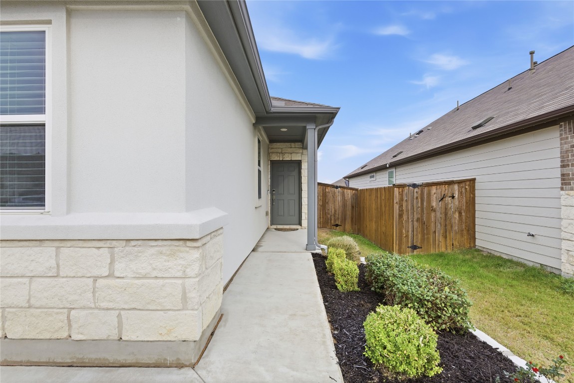 209 Thurman Holt Road Hutto, TX 78634 - Photo 24 of 32 a view of backyard with pathway