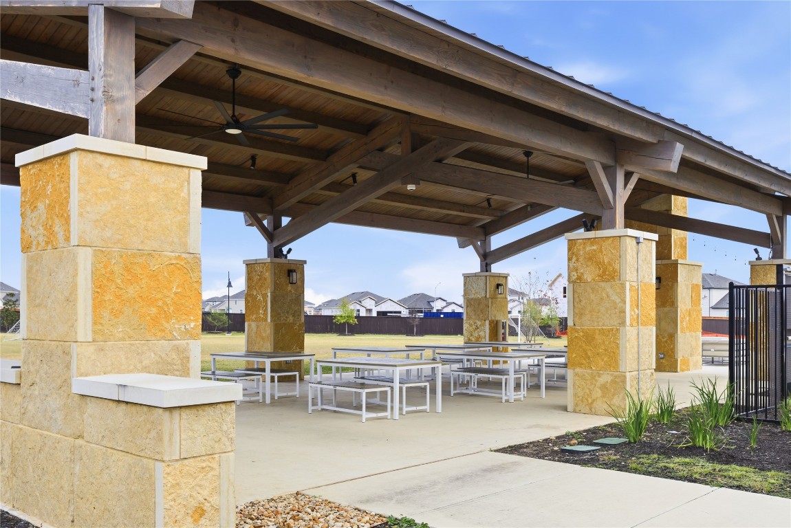 209 Thurman Holt Road Hutto, TX 78634 - Photo 27 of 32 a view of a patio with table and chairs and potted plants