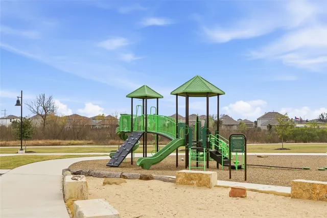 a view of a patio with table and chairs and potted plants