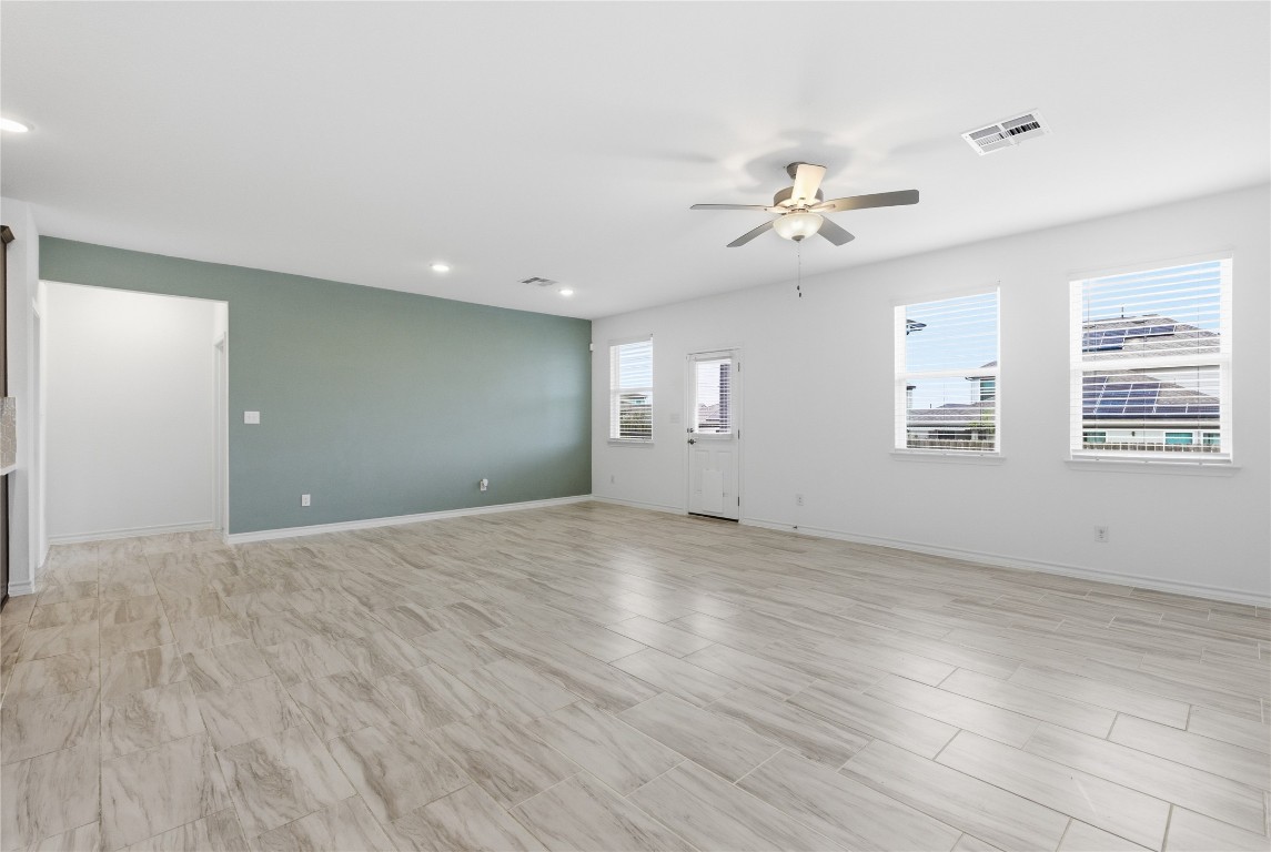 209 Thurman Holt Road Hutto, TX 78634 - Photo 5 of 32 a view of an empty room with a window