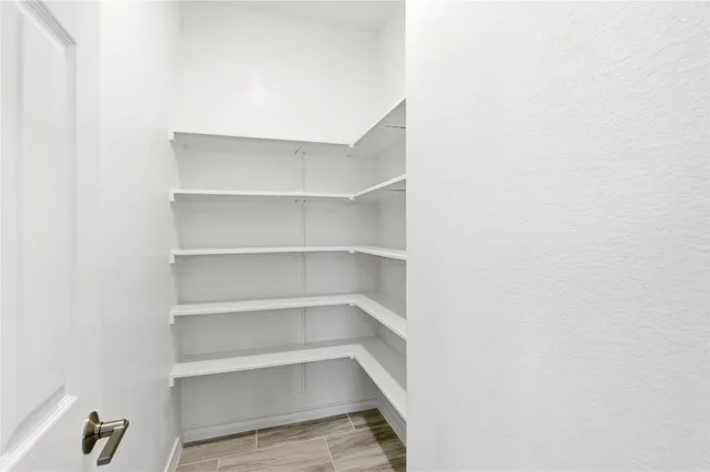 a kitchen with stainless steel appliances granite countertop a refrigerator sink and cabinets