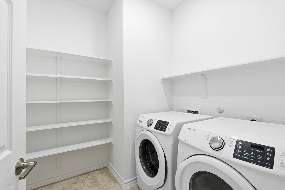 209 Thurman Holt Road Hutto, TX 78634 - Photo 8 of 32 a utility room with dryer and washer