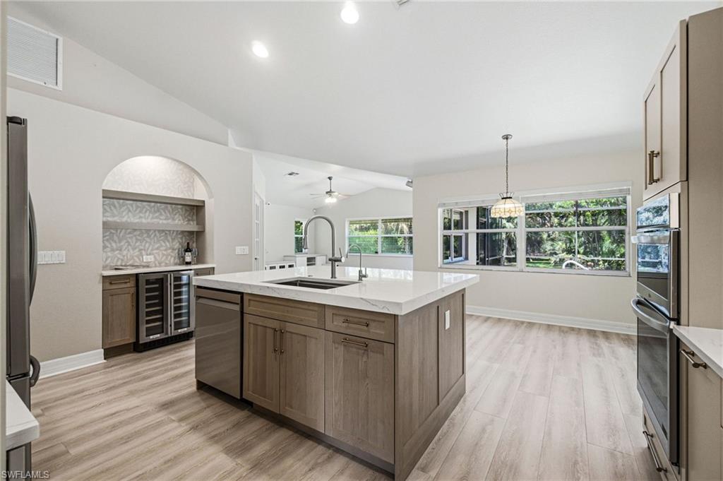 2053 17th Street Southwest Naples, FL 34117 - Photo 9 of 47 a kitchen with a sink and wooden floor