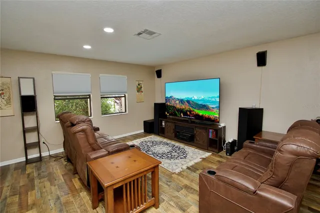 a bedroom with a bed a window and dresser