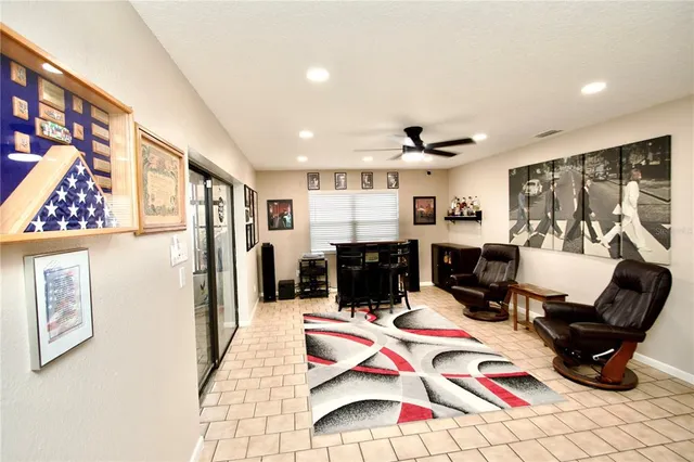 a room with lots of white furniture and a rug